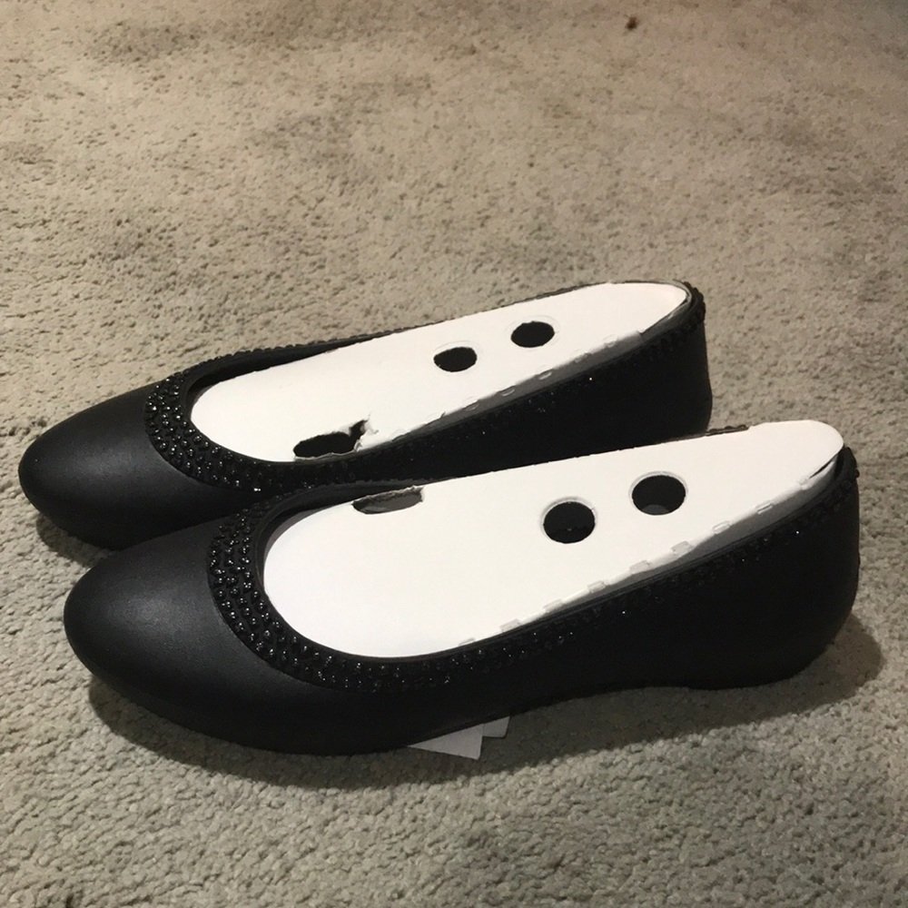 Crocs New in Package. Black dressier flats.